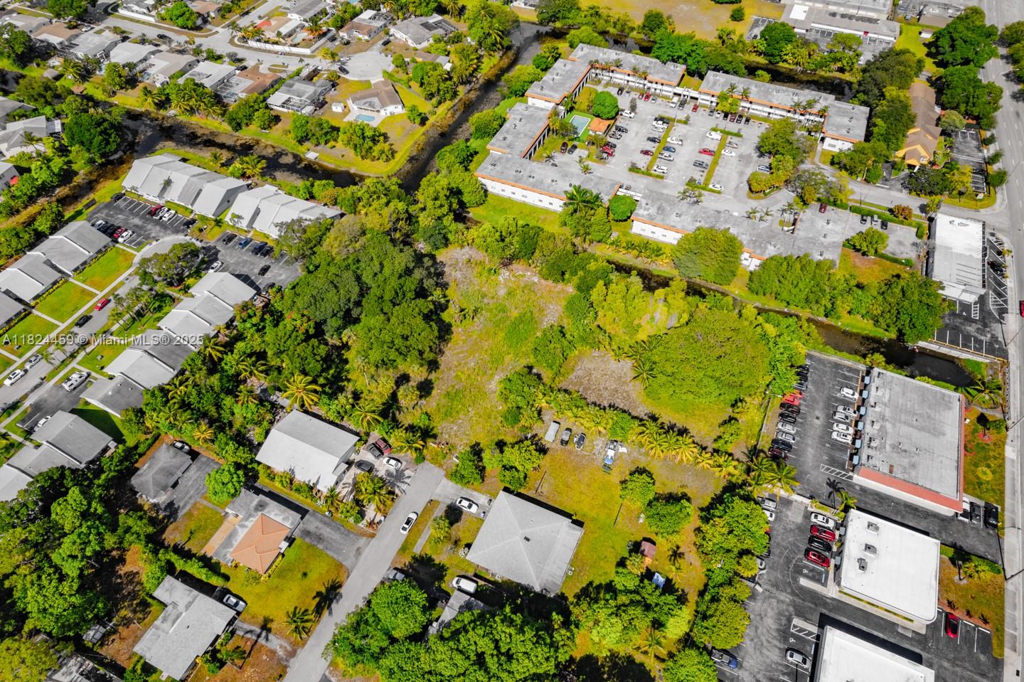 6214 Edwards Road Pompano Beach, FL 33063 - Photo 35 of 41 view of building and mountain view