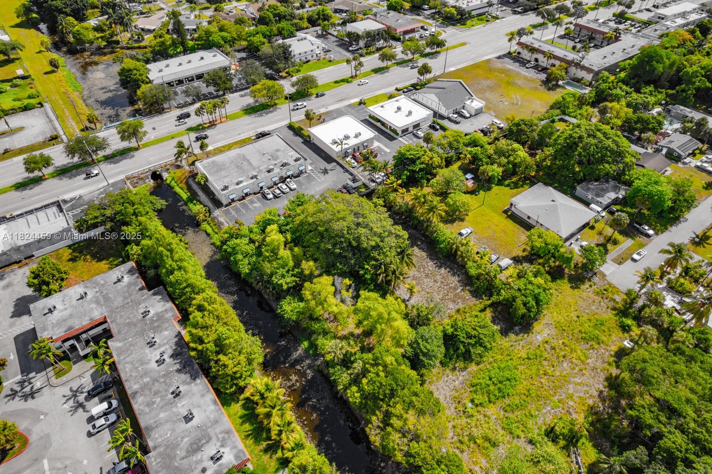 6214 Edwards Road Pompano Beach, FL 33063 - Photo 41 of 41 an aerial view of residential houses with swimming pool
