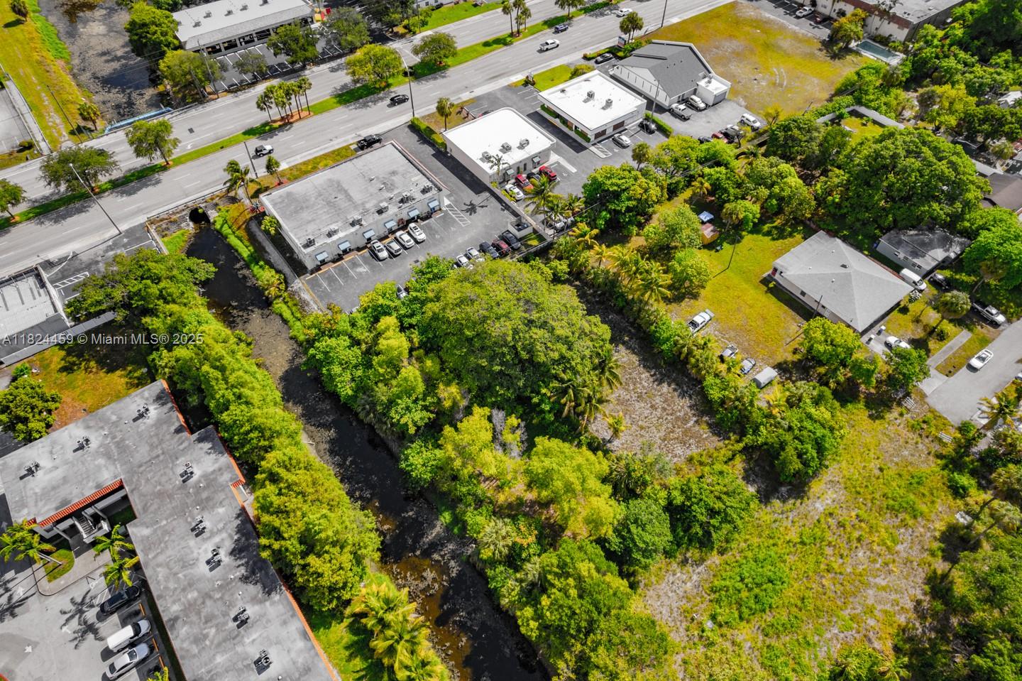 6214 Edwards Road Pompano Beach, FL 33063 - Photo 9 of 41 an aerial view of a residential houses with yard
