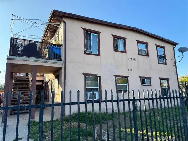 a view of a house with a small yard