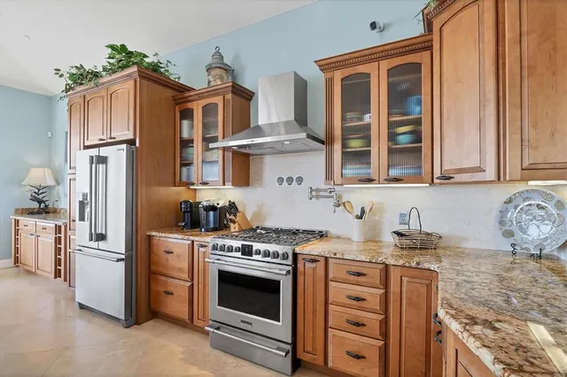 a view of a roof deck with table and chairs potted plants with wooden floor