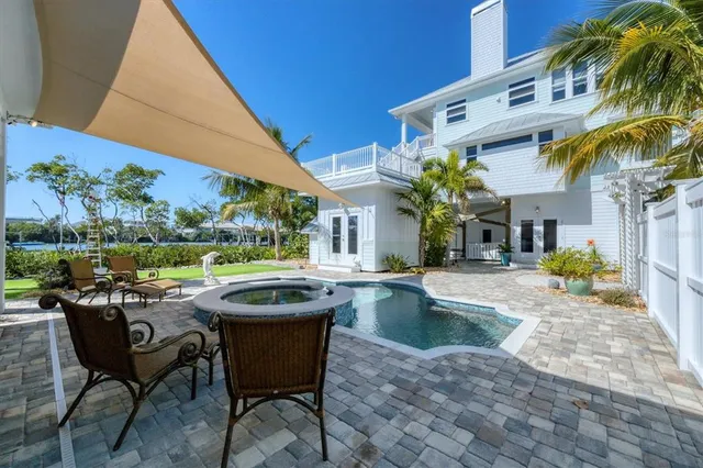 a kitchen with stainless steel appliances granite countertop a stove and a refrigerator