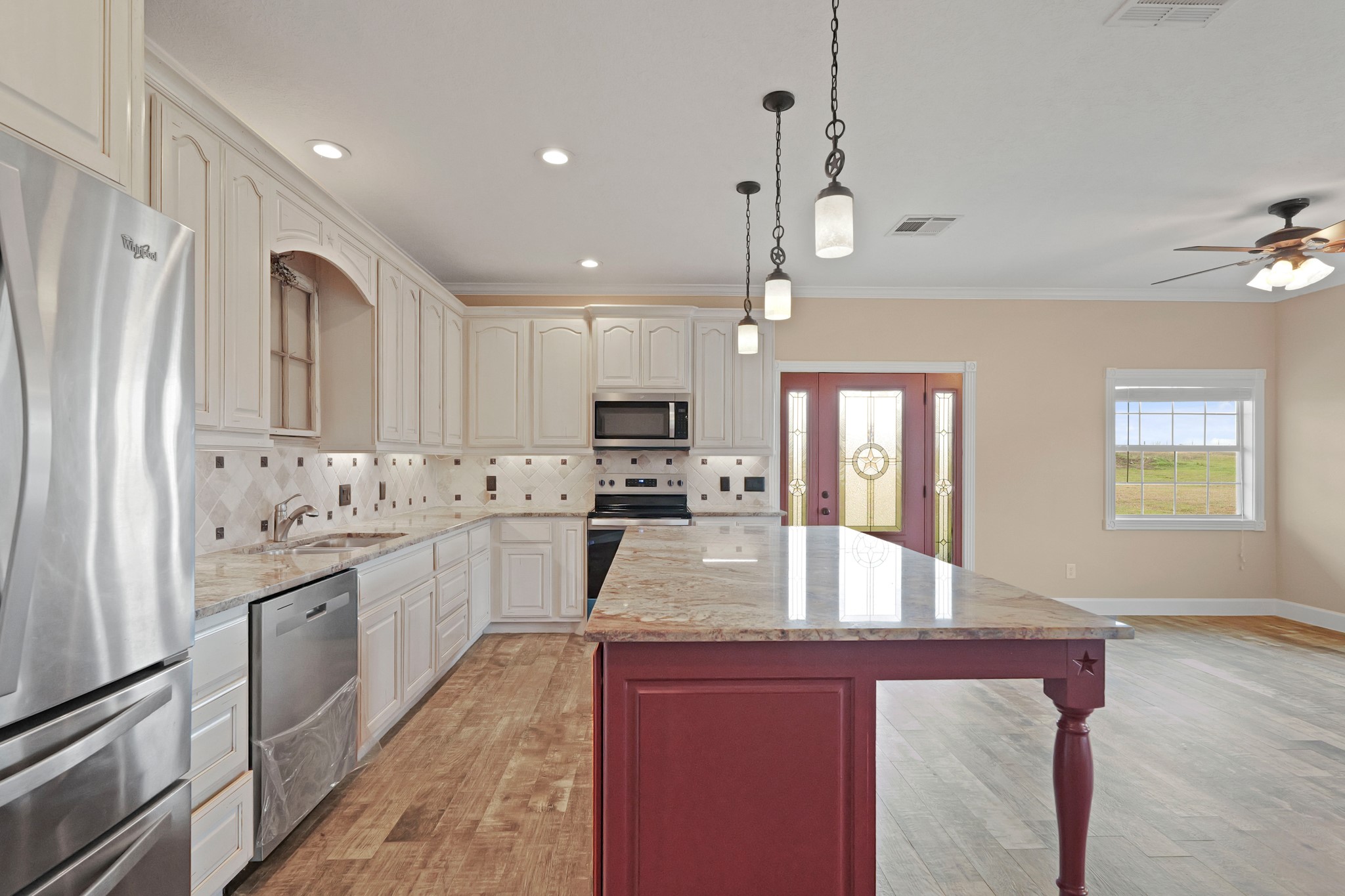 35408 Farm To Market Road 1488 Hempstead, TX 77445 - Photo 13 of 50 a large kitchen with granite countertop a large counter top appliances and cabinets