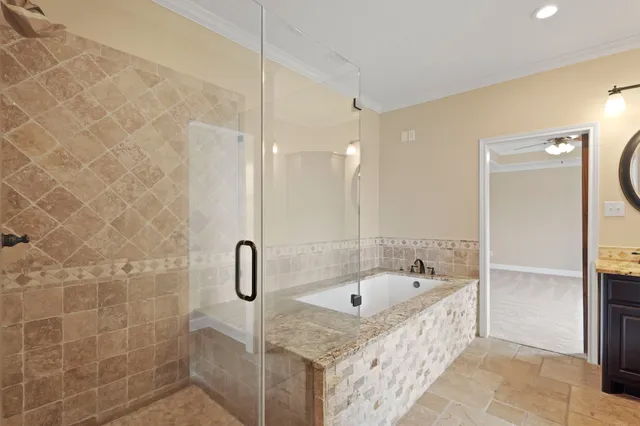 a bathroom with a sink a glass door shower and a mirror