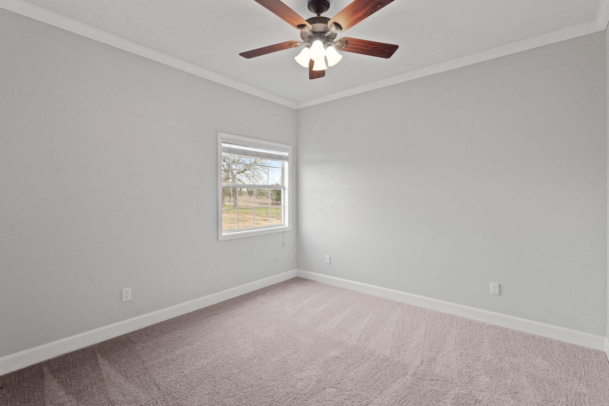 35408 Farm To Market Road 1488 Hempstead, TX 77445 - Photo 37 of 50 an empty room with a window and a fan