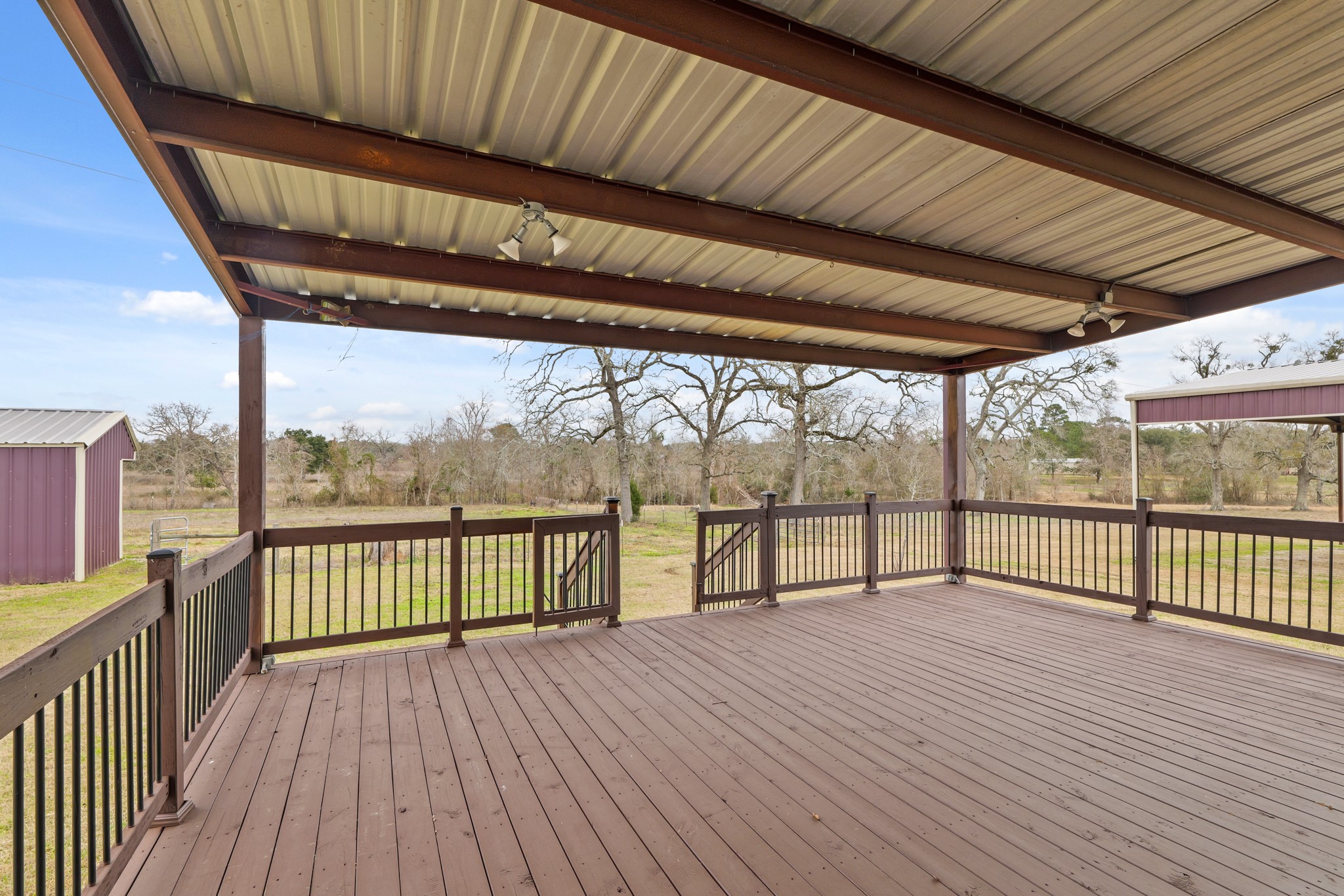35408 Farm To Market Road 1488 Hempstead, TX 77445 - Photo 39 of 50 a view of a balcony with wooden floor