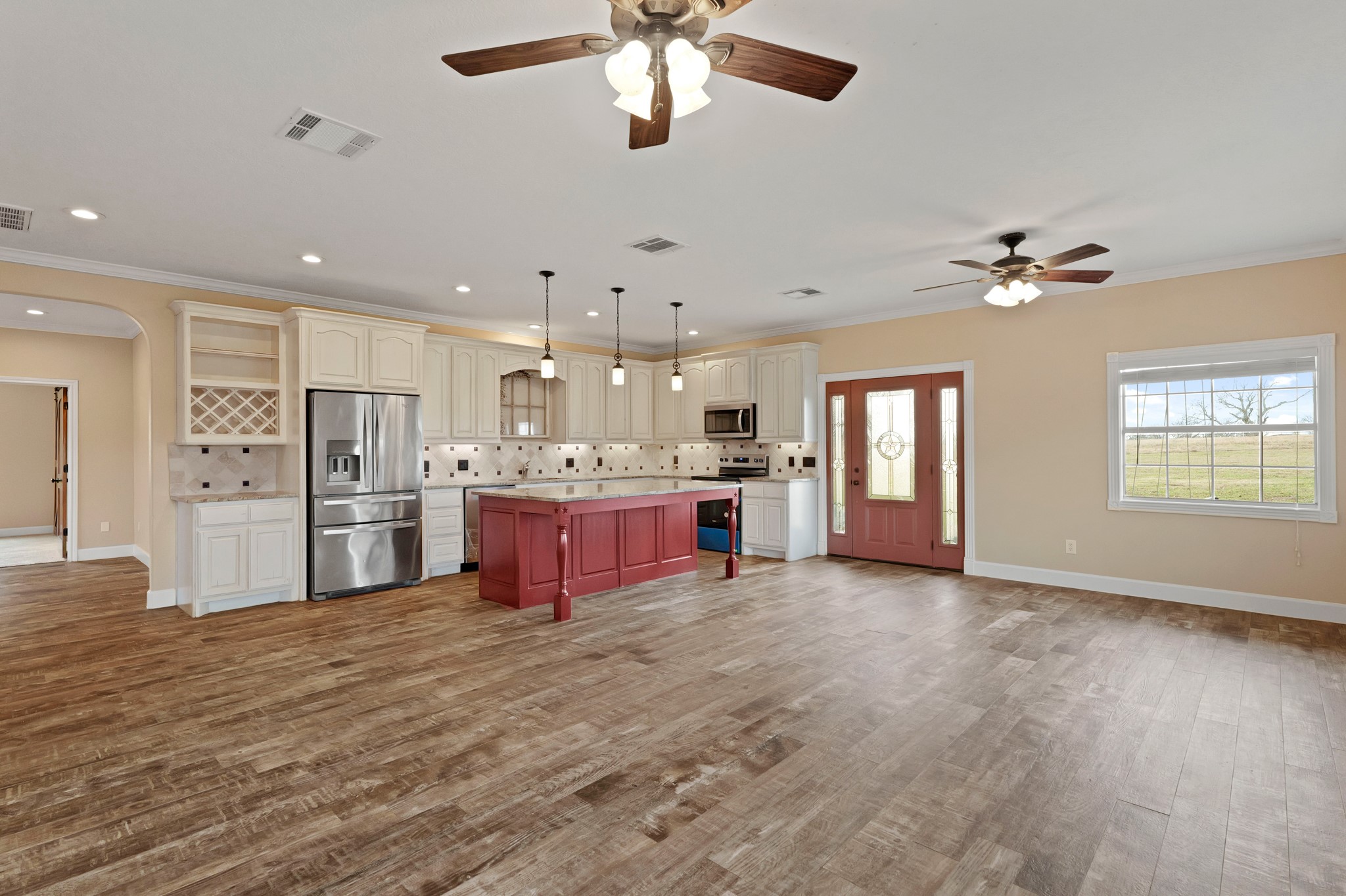 35408 Farm To Market Road 1488 Hempstead, TX 77445 - Photo 7 of 50 a large kitchen with cabinets a sink and stainless steel appliances