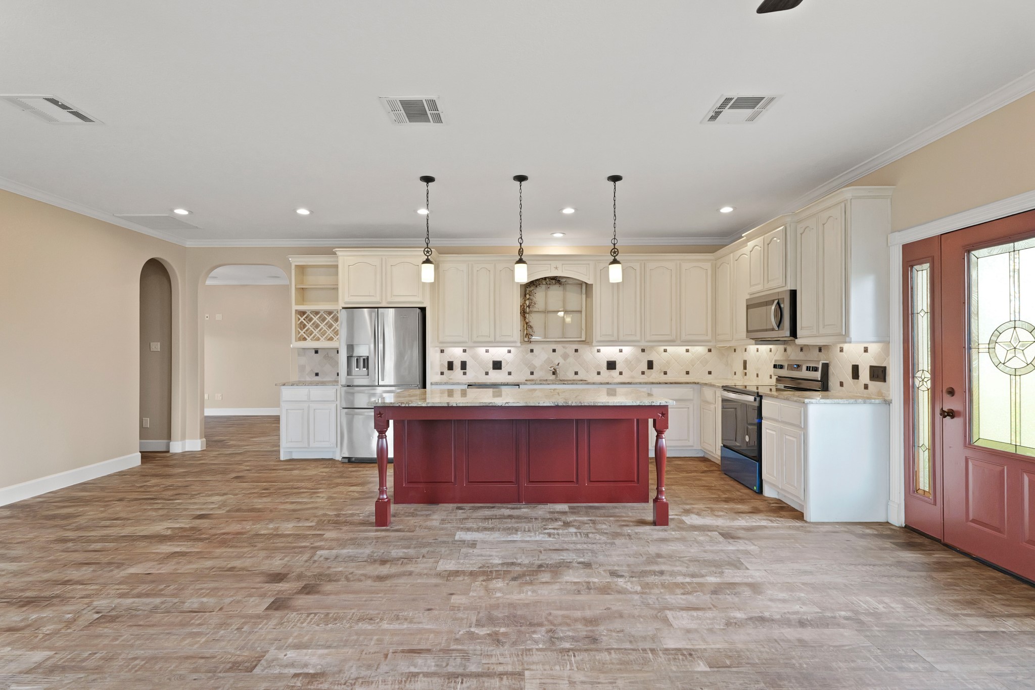 35408 Farm To Market Road 1488 Hempstead, TX 77445 - Photo 8 of 50 a view of kitchen with stainless steel appliances kitchen island granite countertop a stove top oven a sink dishwasher and a refrigerator with wooden floor