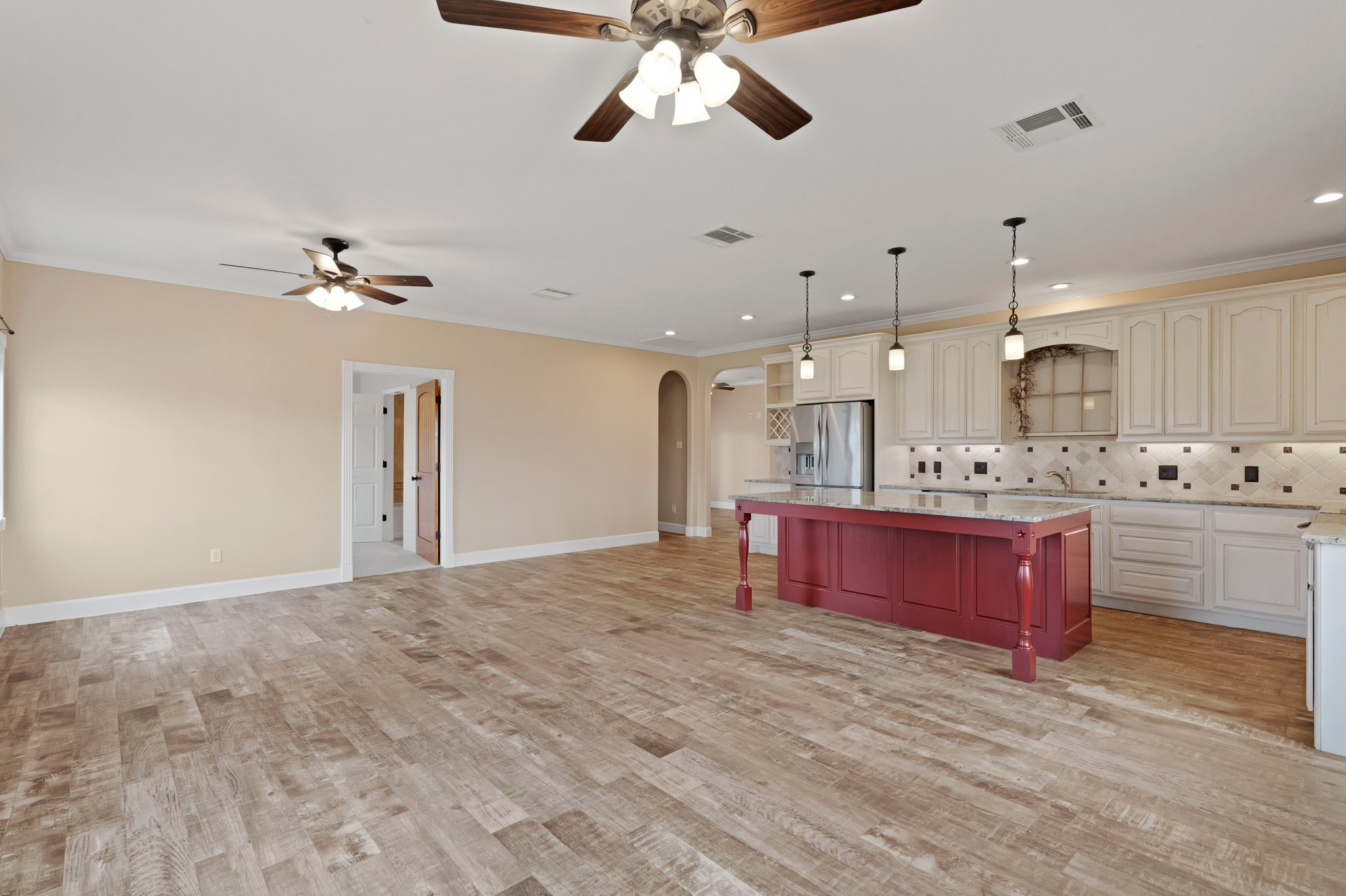 35408 Farm To Market Road 1488 Hempstead, TX 77445 - Photo 9 of 50 a large kitchen with stainless steel appliances kitchen island a chandelier and fireplace