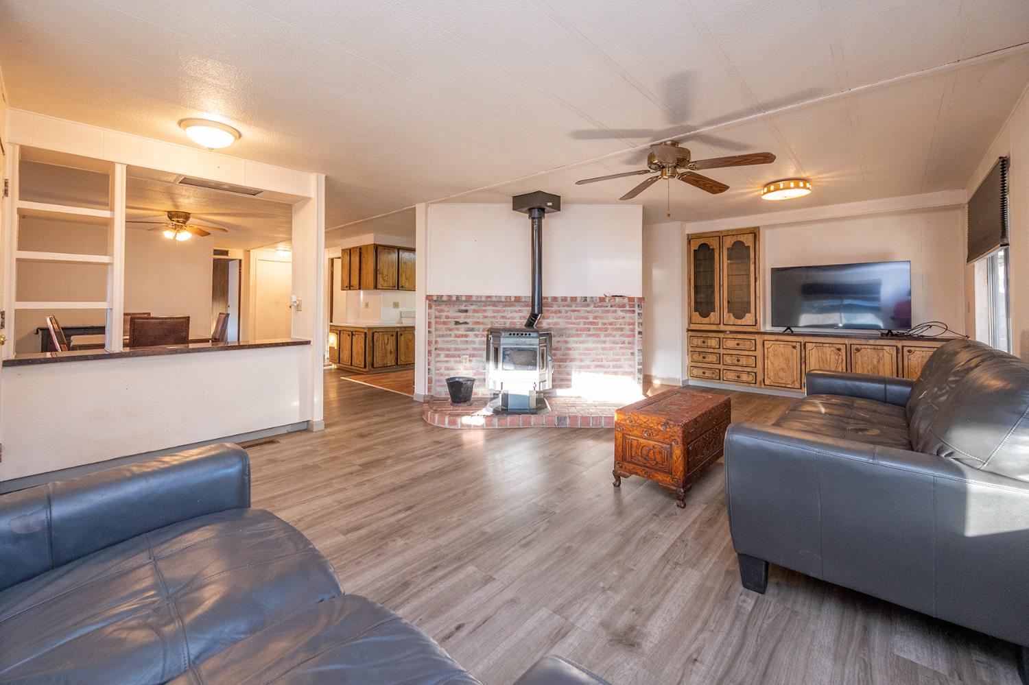 2000 Camanche Road, Unit 234 Ione, CA 95640 - Photo 15 of 41 a living room with fireplace furniture and a wooden floor