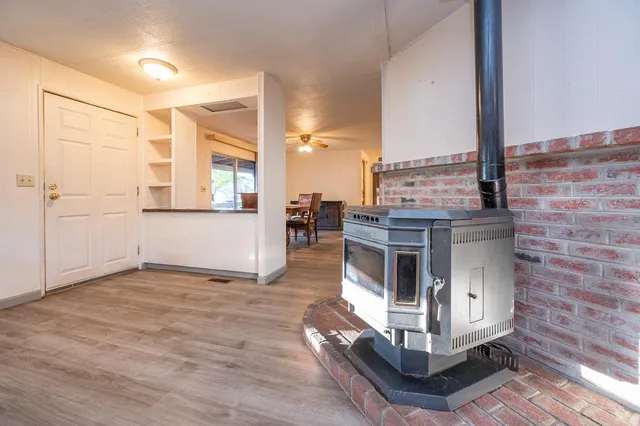 a view of a kitchen with furniture and a fireplace