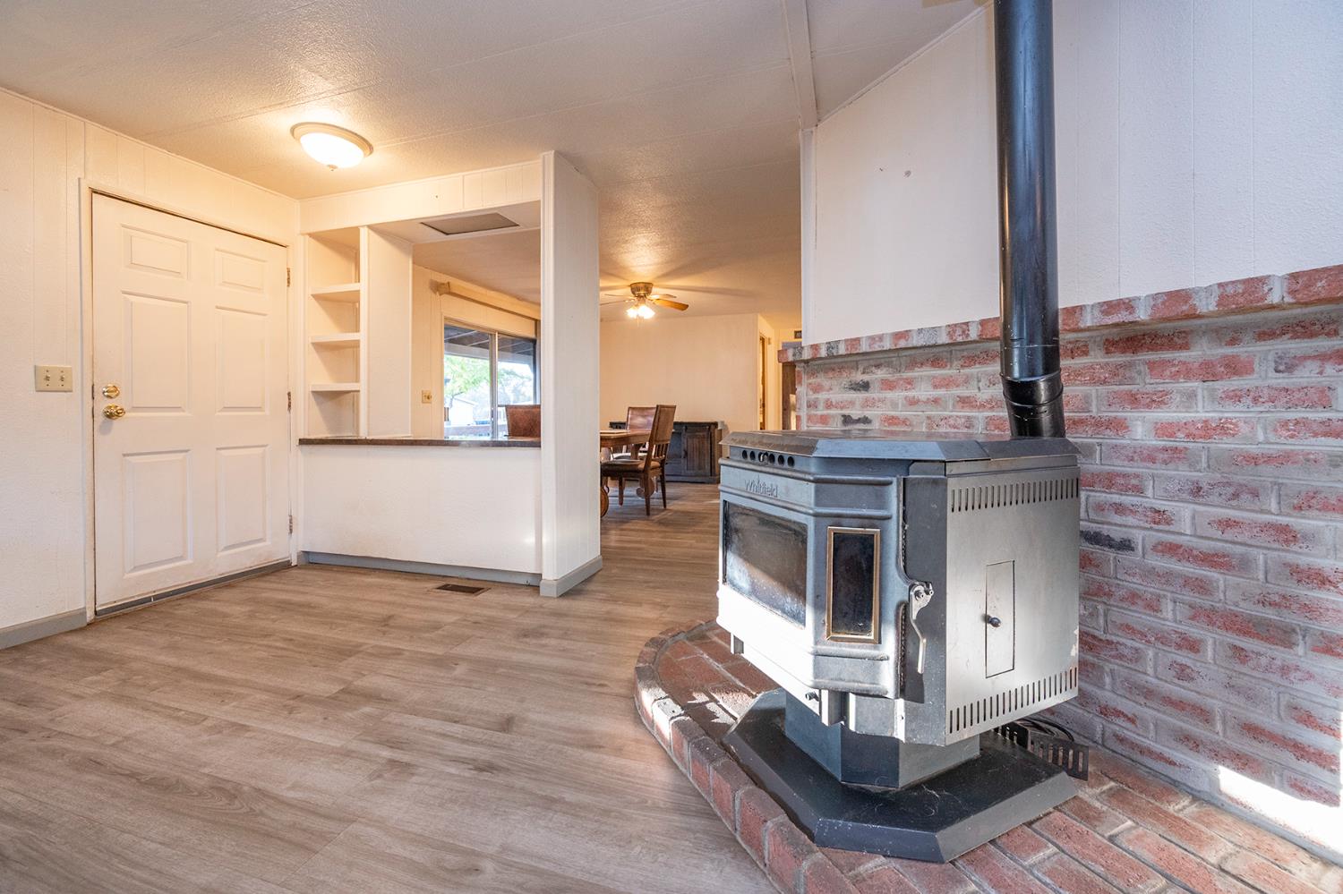 2000 Camanche Road, Unit 234 Ione, CA 95640 - Photo 18 of 41 a view of a kitchen with furniture and a fireplace