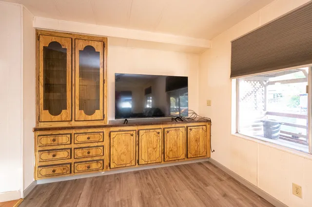 a view of a living room with a large window
