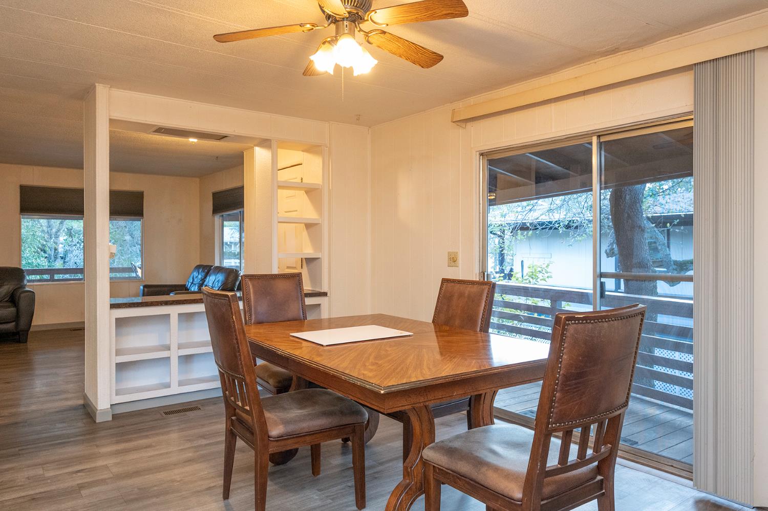 2000 Camanche Road, Unit 234 Ione, CA 95640 - Photo 20 of 41 a dining room with furniture wooden floor and a chandelier