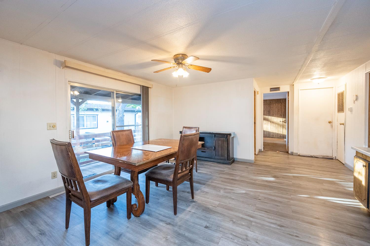 2000 Camanche Road, Unit 234 Ione, CA 95640 - Photo 21 of 41 a view of a dining room with furniture and wooden floor