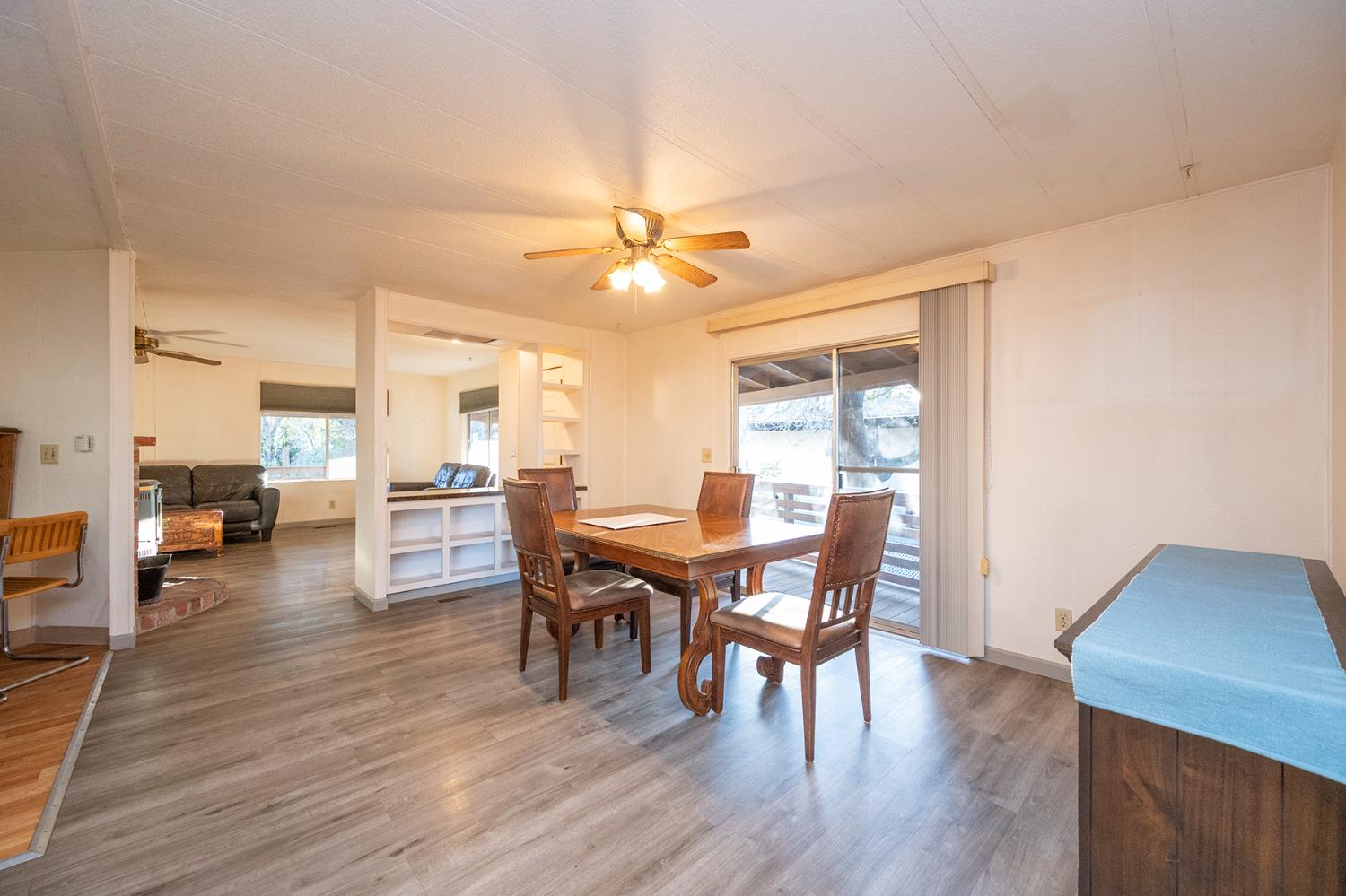 2000 Camanche Road, Unit 234 Ione, CA 95640 - Photo 22 of 41 a view of a dining room with furniture and wooden floor