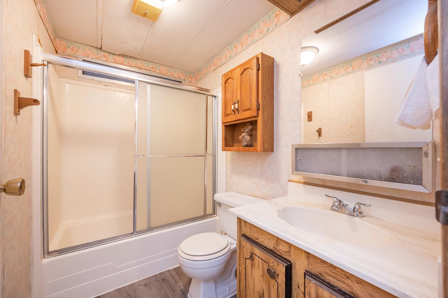 2000 Camanche Road, Unit 234 Ione, CA 95640 - Photo 29 of 41 a bathroom with a sink a toilet and shower