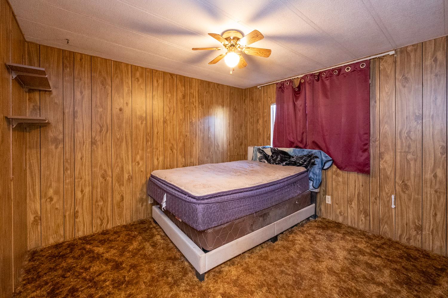 2000 Camanche Road, Unit 234 Ione, CA 95640 - Photo 30 of 41 a bed sitting in a room next to a window