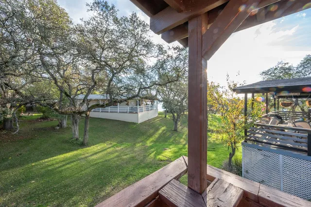 a view of a garden from a balcony