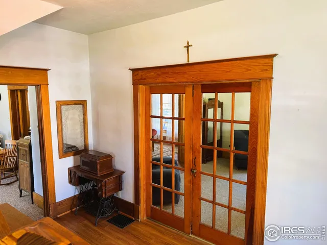 a workspace with wooden floor and a window