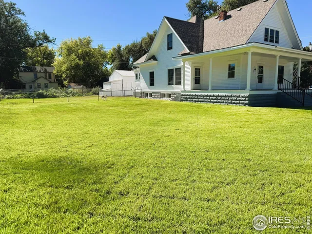 a front view of a house with swimming pool