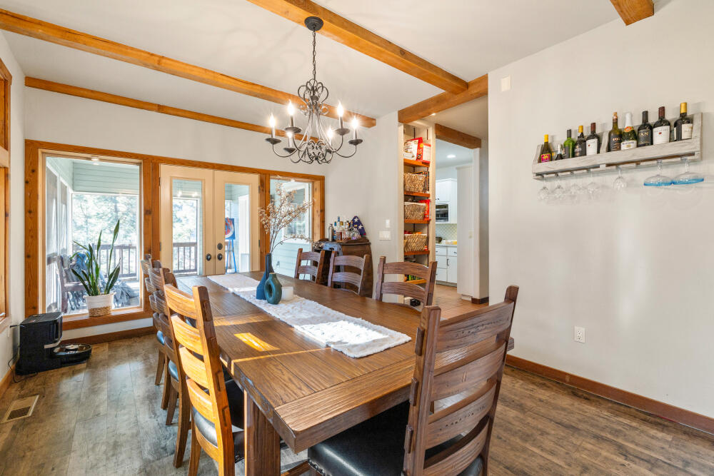 11750 Merganser Road Klamath Falls, OR 97601 - Photo 20 of 66 a view of a dining room with furniture window and wooden floor