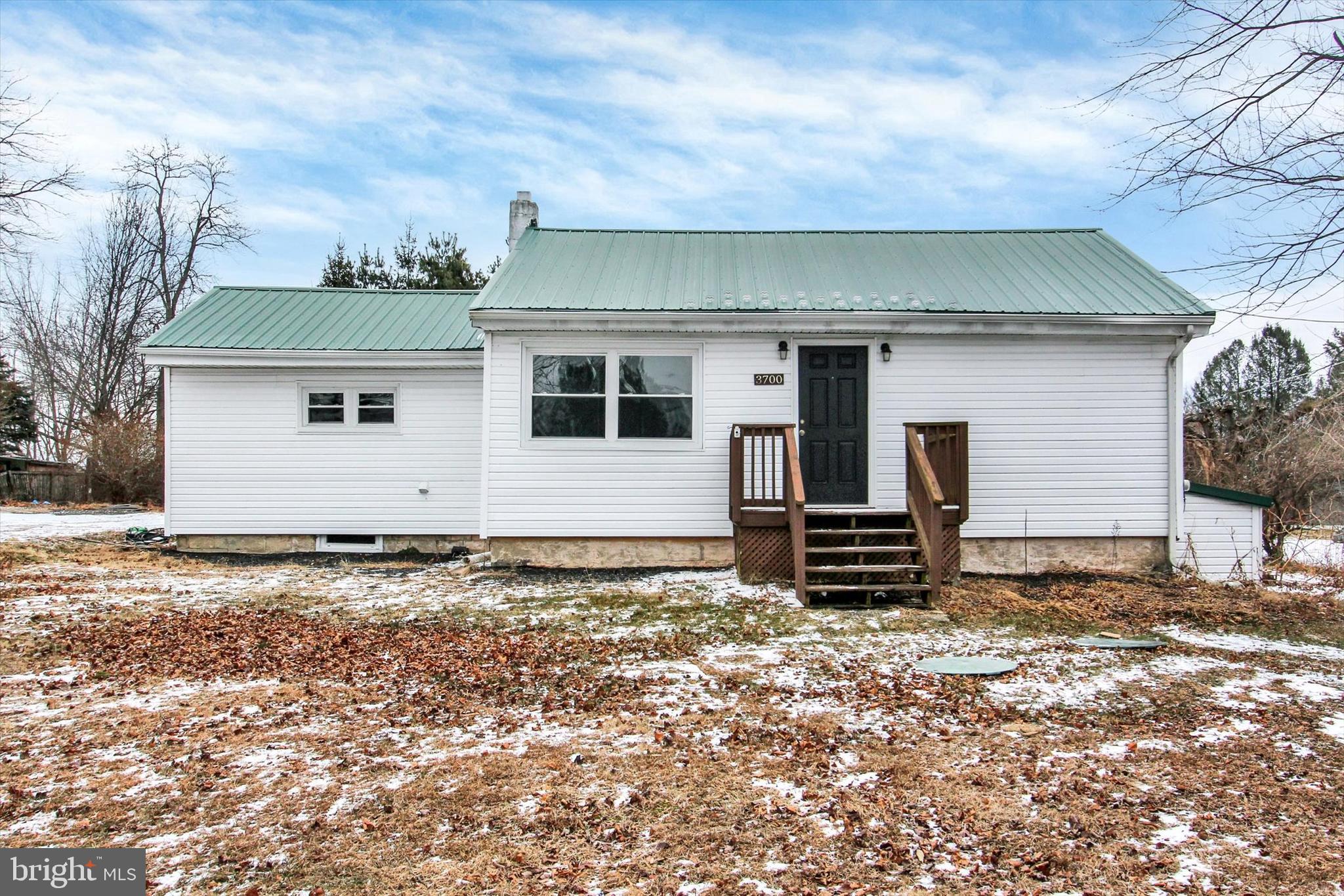 a house view with a backyard space
