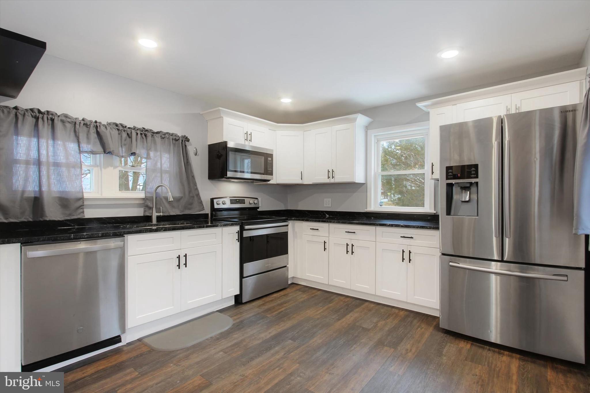 3700 Baltimore Pike Hanover, PA 17331 - Photo 6 of 21 a kitchen with granite countertop stainless steel appliances a refrigerator sink and microwave