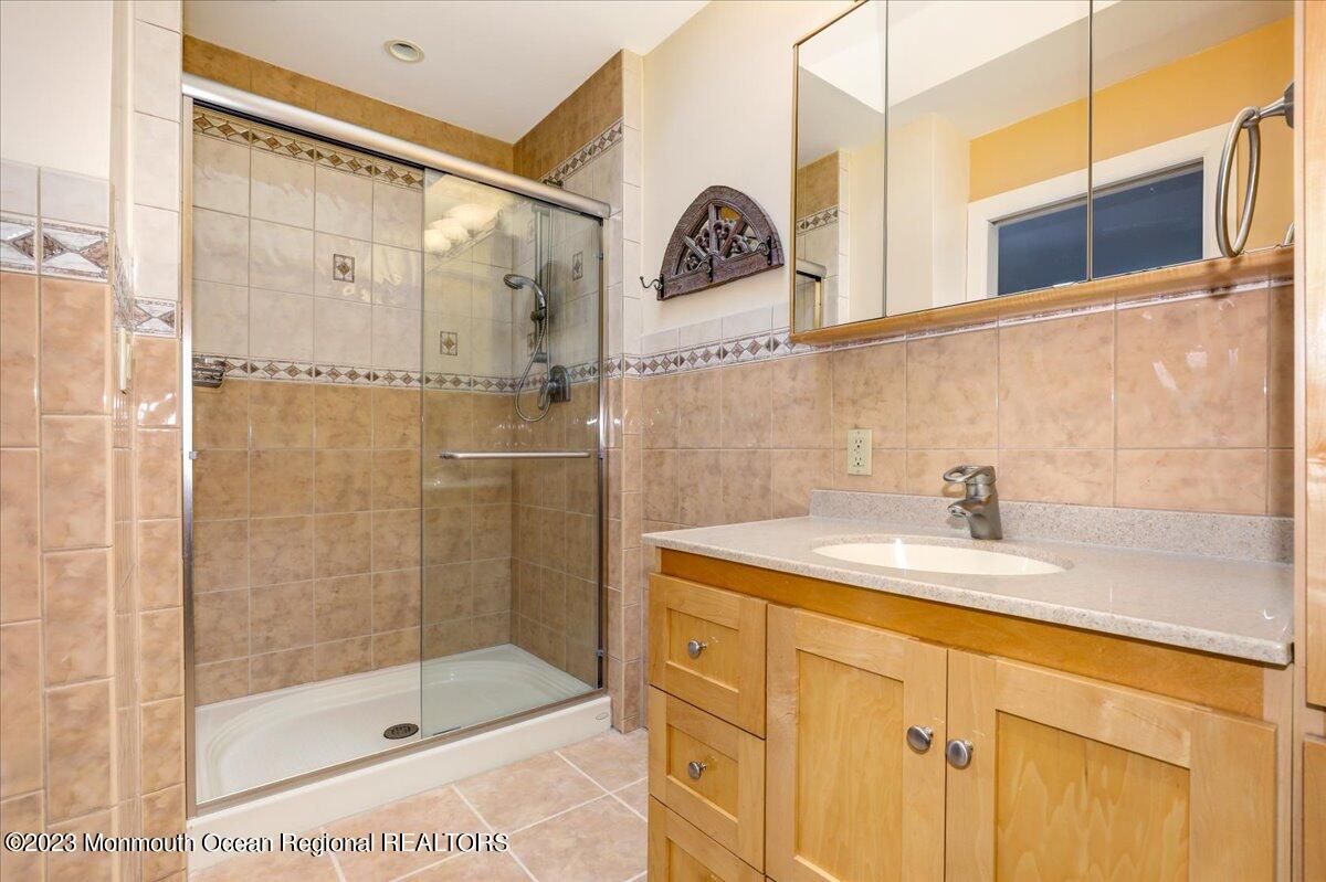 56 Wyckham Road Tinton Falls, NJ 07724 - Photo 32 of 40 a bathroom with a shower and a sink