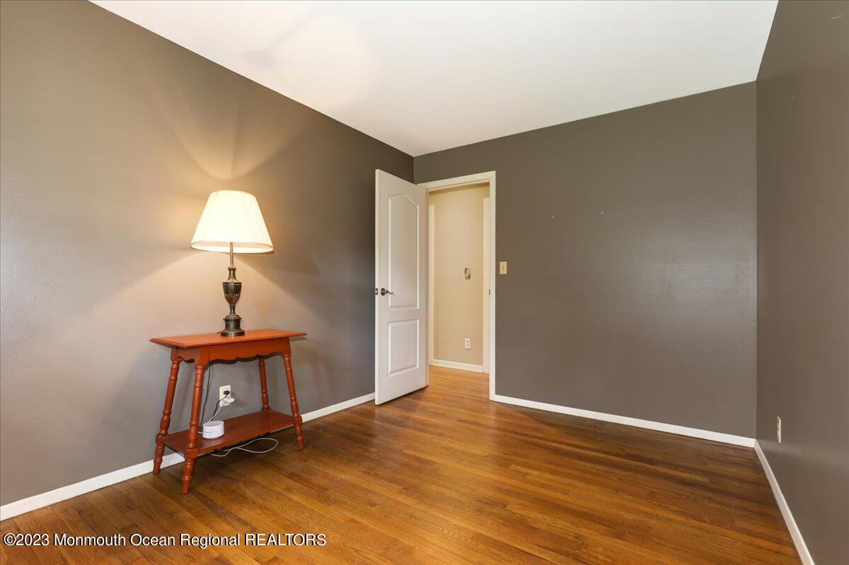 56 Wyckham Road Tinton Falls, NJ 07724 - Photo 36 of 40 a room with a table and a potted plant