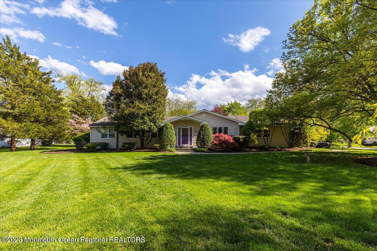 56 Wyckham Road Tinton Falls, NJ 07724 - Photo 7 of 40 a front view of house with yard and trees