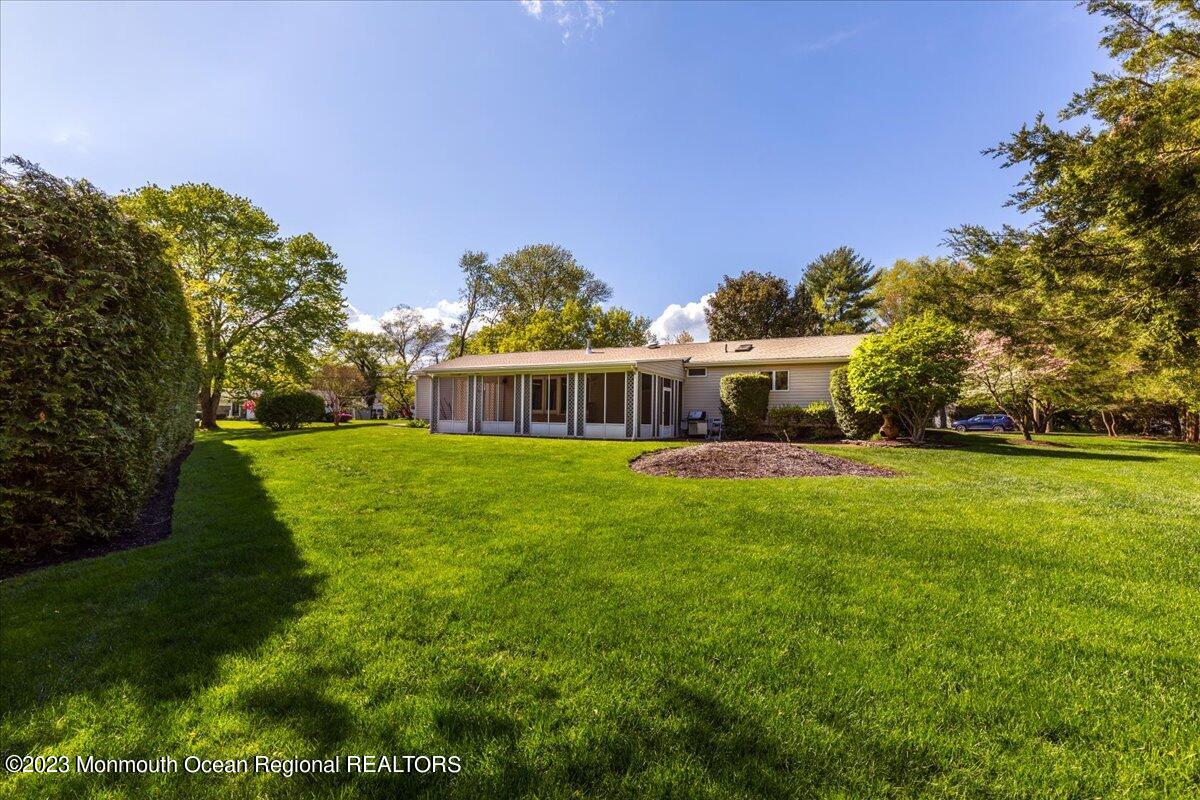 56 Wyckham Road Tinton Falls, NJ 07724 - Photo 9 of 40 a front view of house with yard and green space