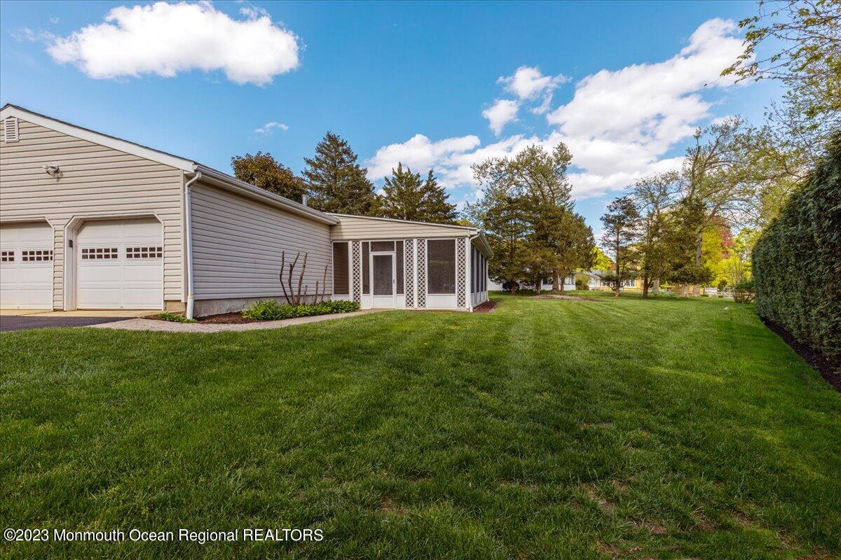 56 Wyckham Road Tinton Falls, NJ 07724 - Photo 10 of 40 a view of a house with a backyard