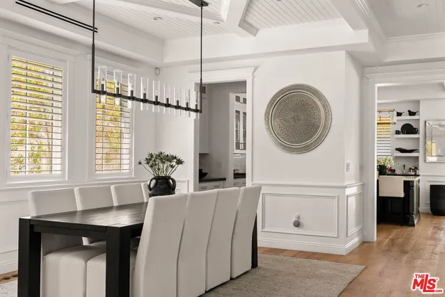 a living room with furniture a window and a clock