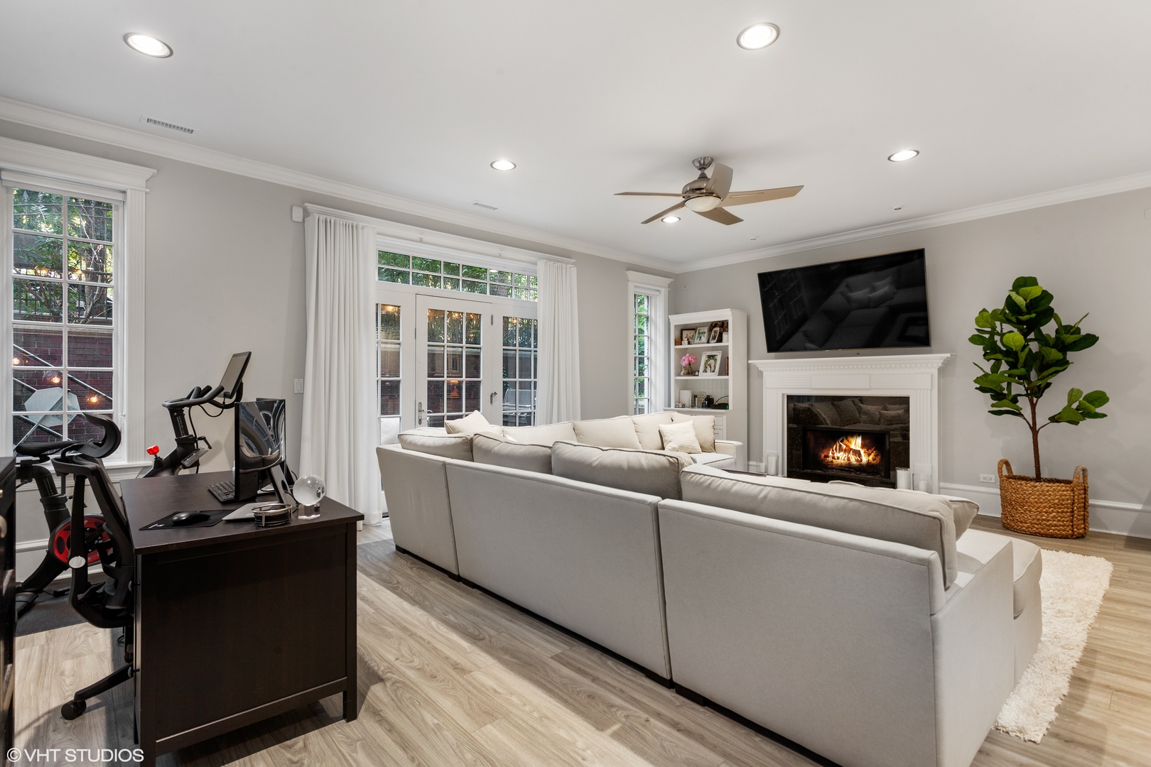 1363 North Mohawk Street, Unit 1 Chicago, IL 60610 - Photo 6 of 14 a living room with furniture a flat screen tv and a fireplace