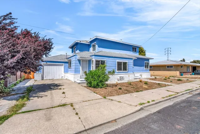a front view of a house with a patio