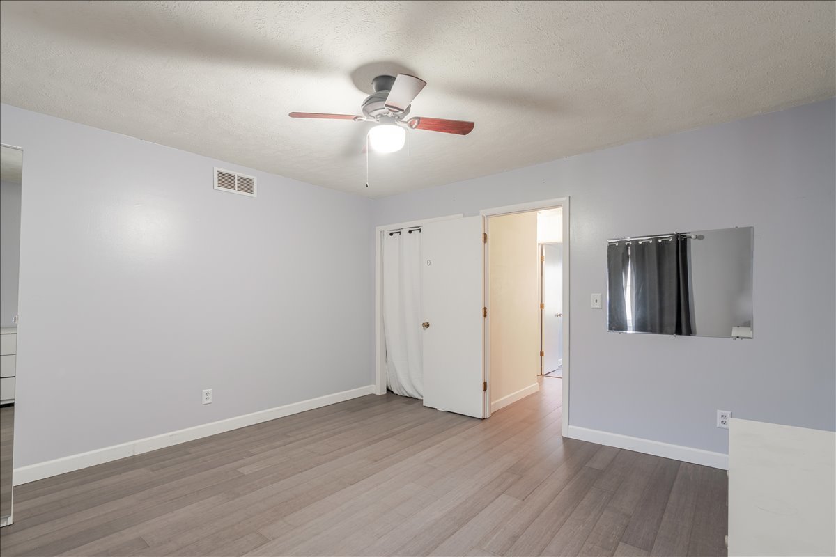 103 South Towanda Avenue, Unit 3 Normal, IL 61761 - Photo 13 of 17 a view of an empty room with wooden floor