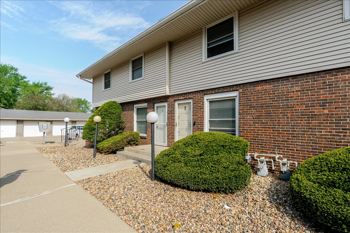 103 South Towanda Avenue, Unit 3 Normal, IL 61761 - Photo 2 of 17 a view of a house with a chairs in a patio