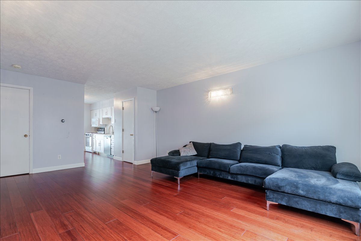103 South Towanda Avenue, Unit 3 Normal, IL 61761 - Photo 4 of 17 a living room with furniture and wooden floor