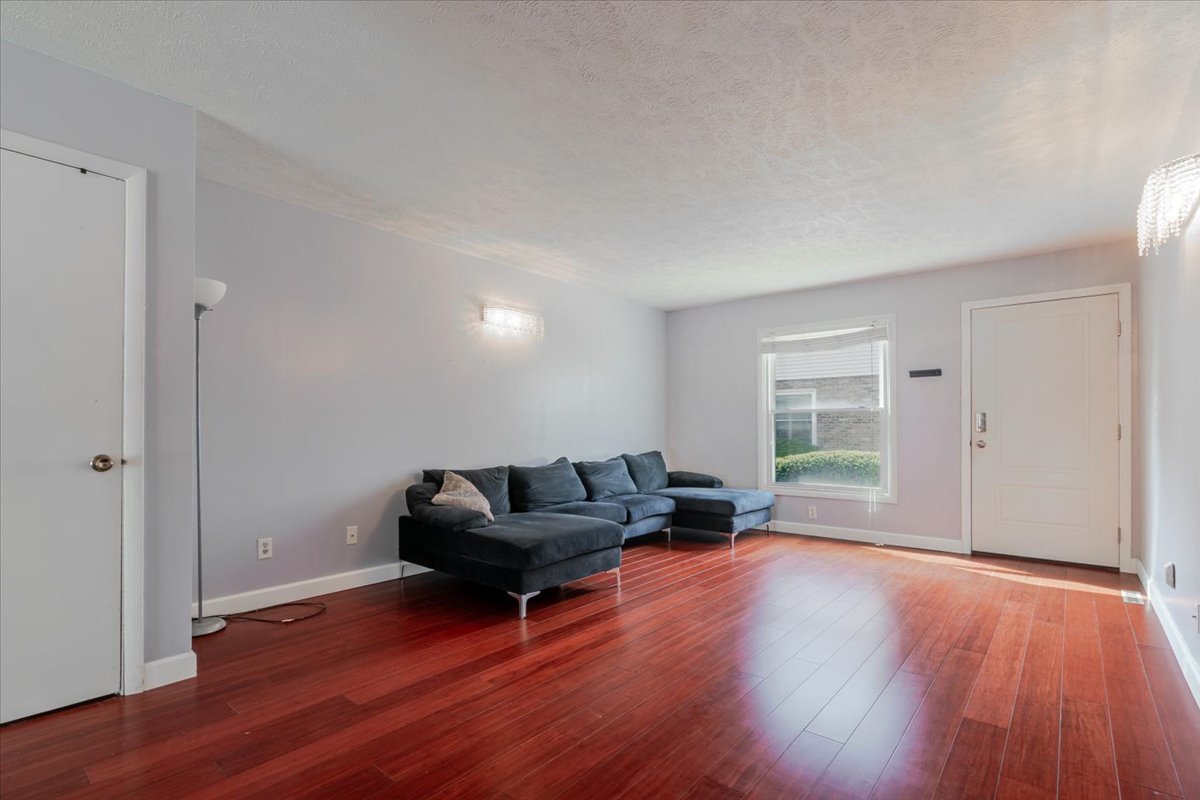 103 South Towanda Avenue, Unit 3 Normal, IL 61761 - Photo 5 of 17 a living room with furniture and a hard wood floor