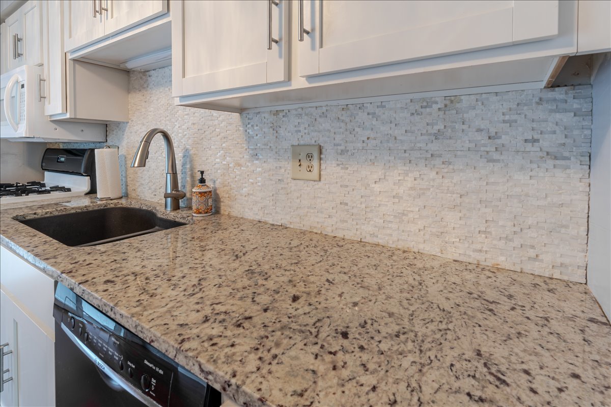 103 South Towanda Avenue, Unit 3 Normal, IL 61761 - Photo 8 of 17 a kitchen with a sink and cabinets