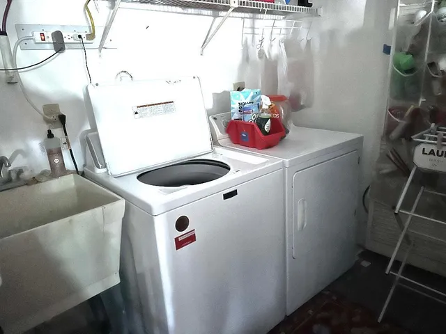 an aerial view of residential houses with outdoor space and street view