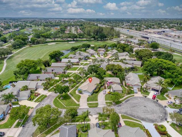 a view of a backyard with potted plants