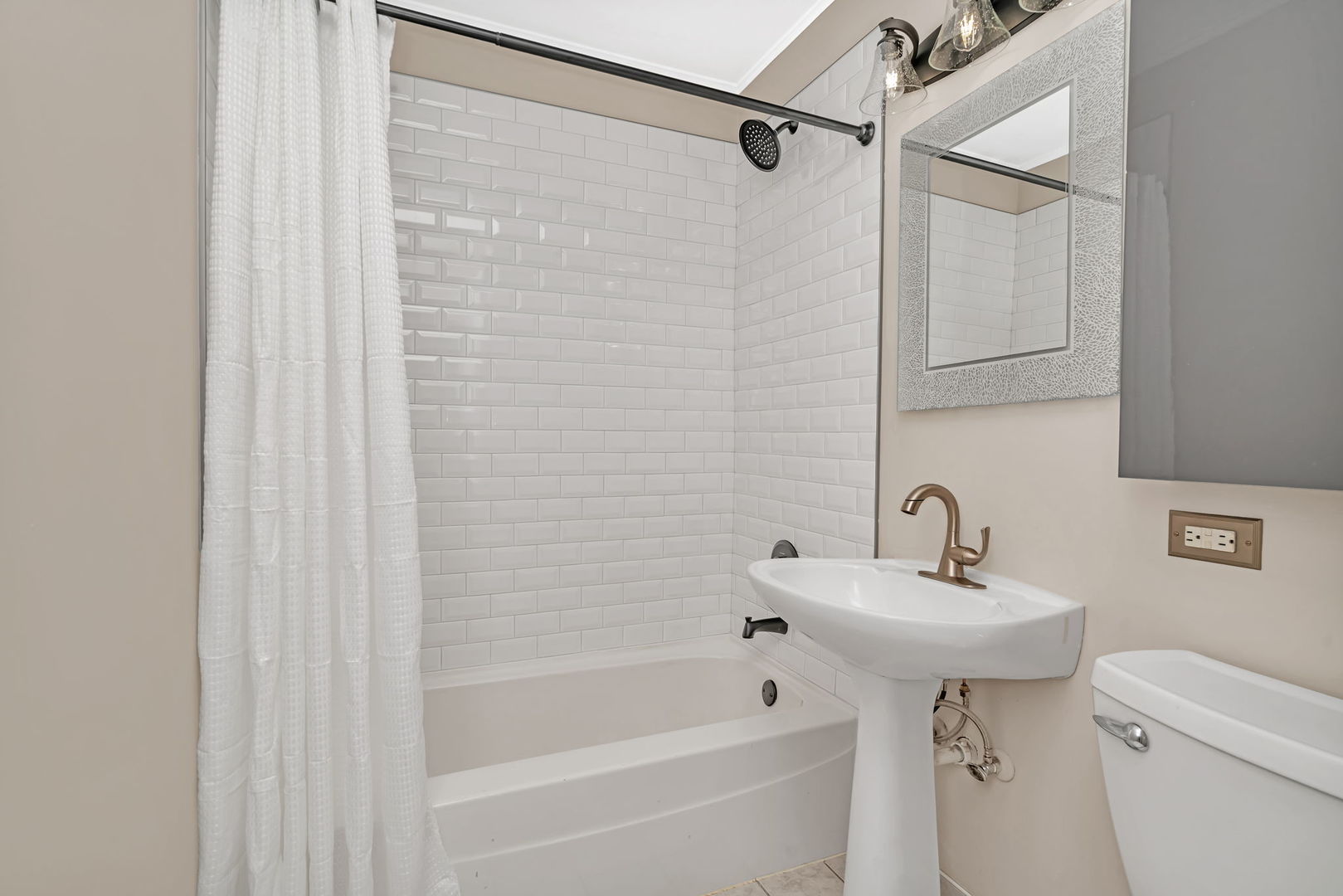 4239 Custer Avenue Lyons, IL 60534 - Photo 15 of 27 a bathroom with a sink a toilet and shower