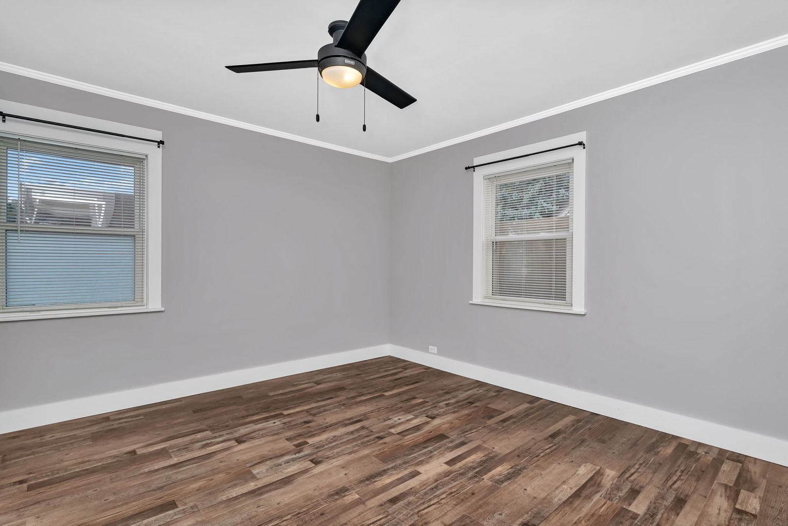 4239 Custer Avenue Lyons, IL 60534 - Photo 16 of 27 a view of empty room with wooden floor and fan