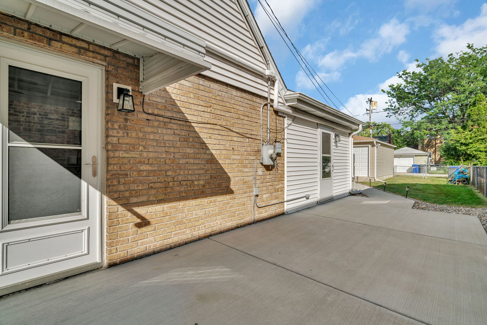 4239 Custer Avenue Lyons, IL 60534 - Photo 23 of 27 a view of a house with a door and a window