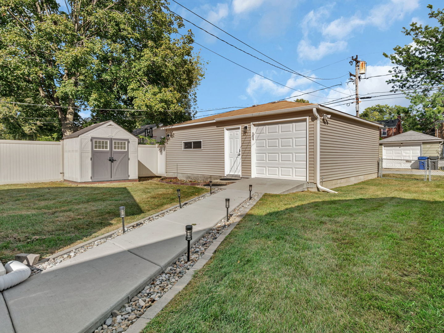 4239 Custer Avenue Lyons, IL 60534 - Photo 25 of 27 a front view of a house with a yard