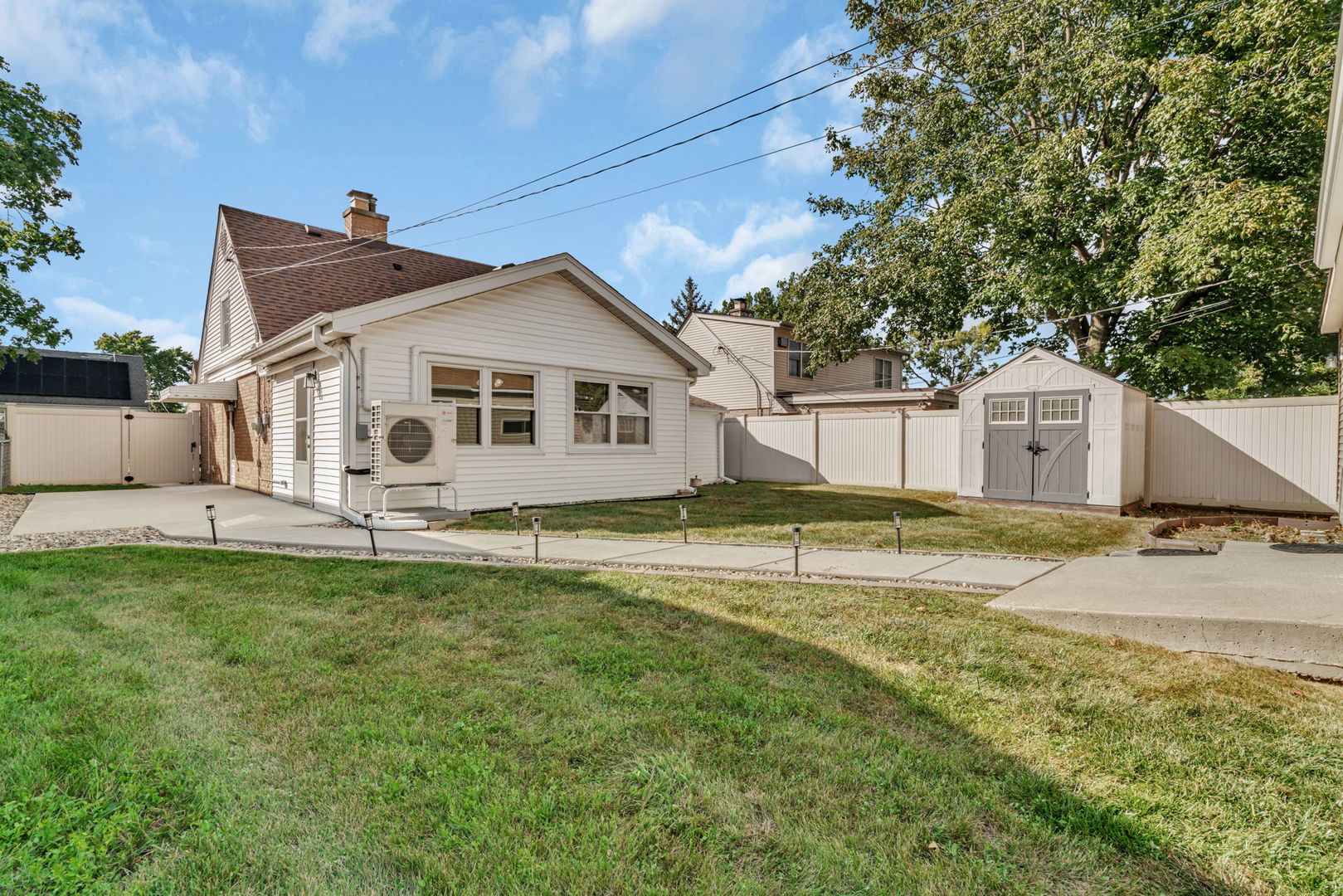 4239 Custer Avenue Lyons, IL 60534 - Photo 26 of 27 a view of a house with a yard and sitting area