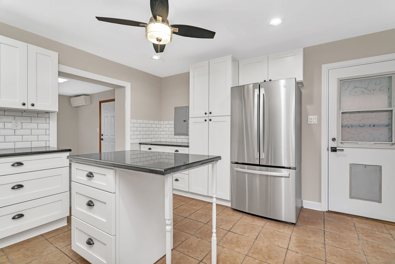 4239 Custer Avenue Lyons, IL 60534 - Photo 9 of 27 a kitchen with granite countertop a refrigerator and a sink