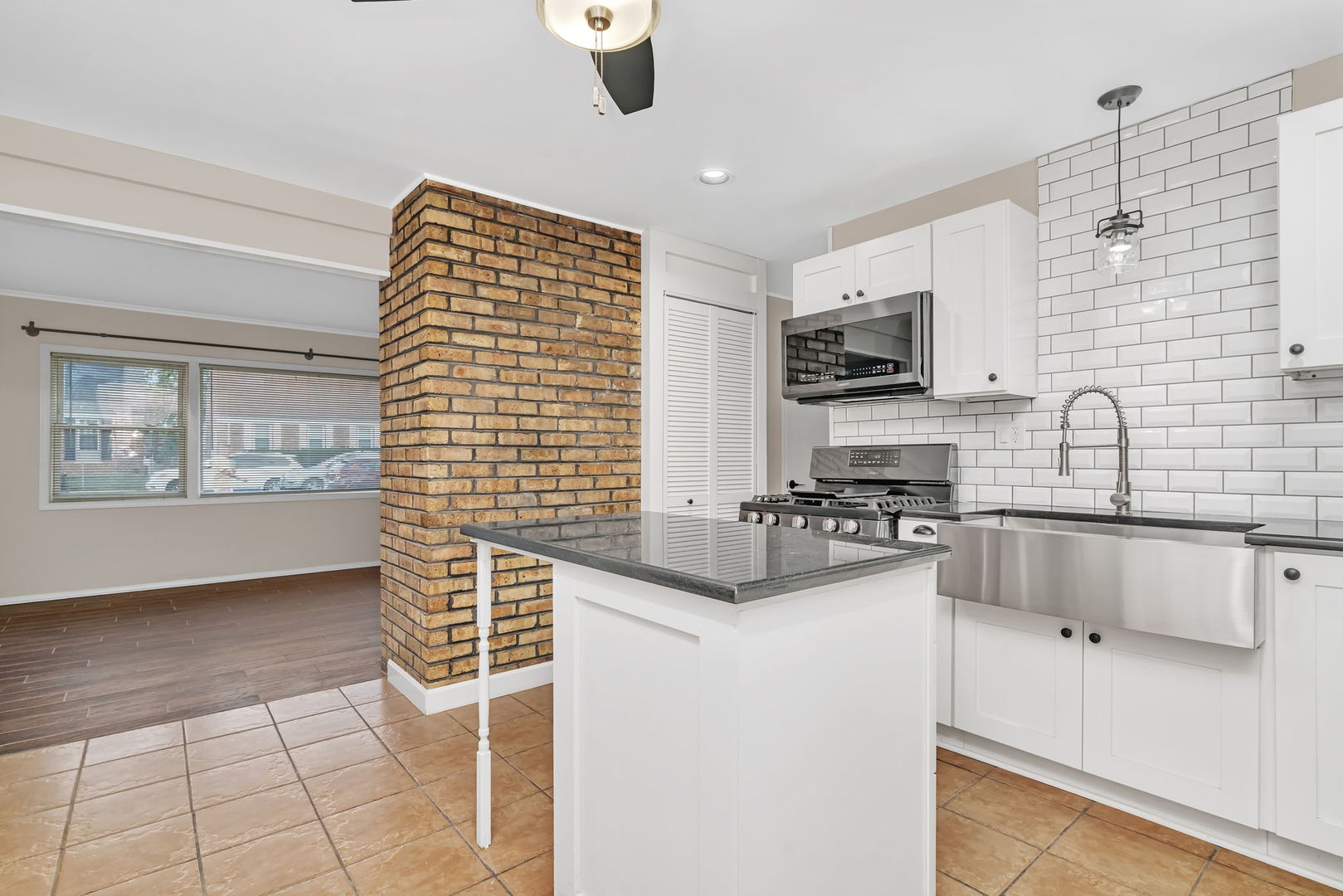 4239 Custer Avenue Lyons, IL 60534 - Photo 10 of 27 a kitchen with stainless steel appliances a sink stove and refrigerator